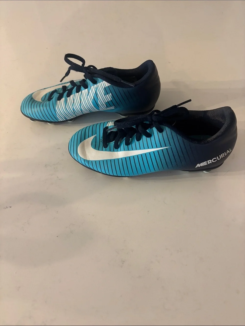 Nike Kids Teal and Navy Striped Soccer Shoes